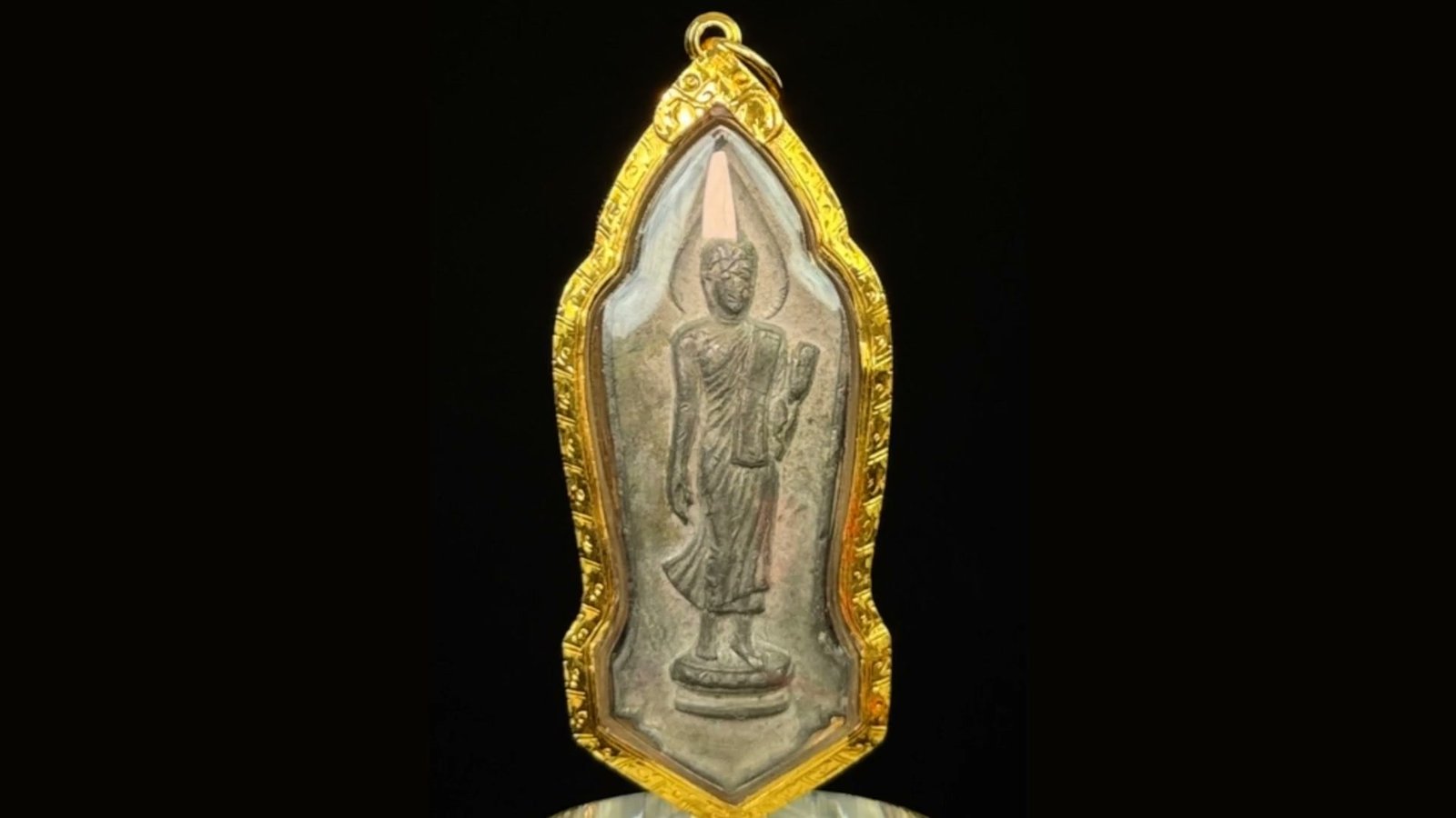 Amulet photographed on the bench